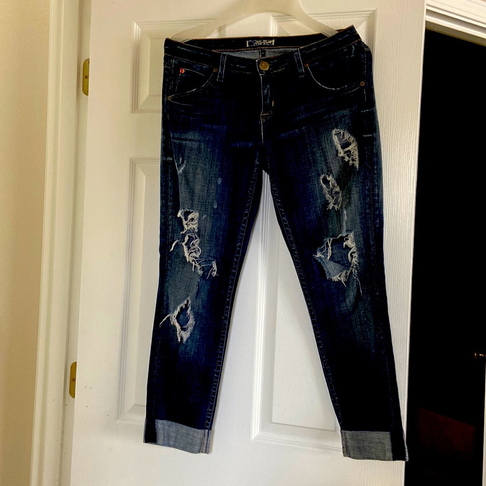 Ripped dark blue jeans. Fits super well